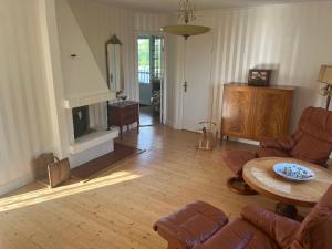 a living room with a couch and a table at Hallhult in Nässjö