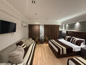 A bed or beds in a room at Blue Istanbul Hotel Taksim