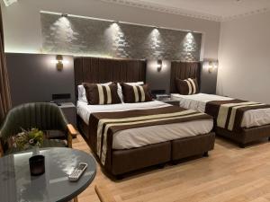 A bed or beds in a room at Blue Istanbul Hotel Taksim