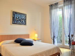 Posteľ alebo postele v izbe v ubytovaní Small residence with swimming pool and 8 lovely apartments