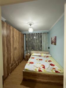 a bedroom with a bed in a room at Krena Apartament in Durrës