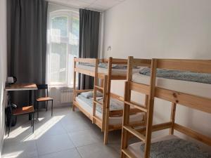 Postel nebo postele na pokoji v ubytování Golden Hostel