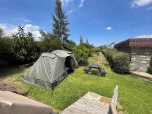 a tent and a picnic table in a yard at Camping Near Mt Longonot, Elwai Camping Centre in Heni Village