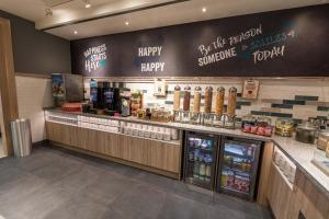 a fast food restaurant with a happy birthday sign on the wall at Hampton by Hilton Bournemouth in Bournemouth