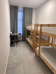 Postel nebo postele na pokoji v ubytování Golden Hostel