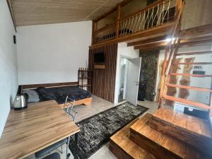 a bedroom with a bed and a desk in a room at Privat-Villa-Котедж in Mykulychyn