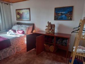 Postel nebo postele na pokoji v ubytování Casa de Boneca