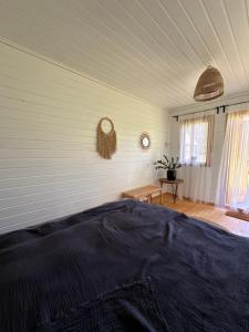 a bedroom with a bed in a room at Vaide kempings in Vaide