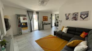 a living room with a couch and a table at La casa di Francy B&B in Bracigliano