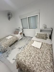Ένα ή περισσότερα κρεβάτια σε δωμάτιο στο Luxury flat Mar de Cristal