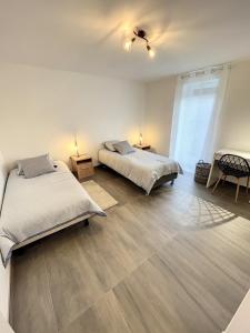 Postel nebo postele na pokoji v ubytování Maison T3 - Classée 3 étoiles + 7 fotografií