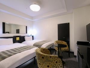 Postel nebo postele na pokoji v ubytování APA Hotel Kanda Ekihigashi + 37 fotografií