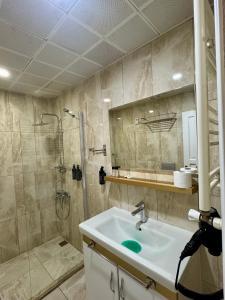 a bathroom with a sink and a shower at Ensar Apart in Uzungöl +69 photos