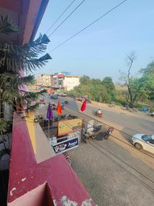 a view of a street from a building with a red roof at hotel aadarsh in Sendhwa