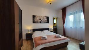 Postel nebo postele na pokoji v ubytování Holiday Residences Baile Felix 1 Mai