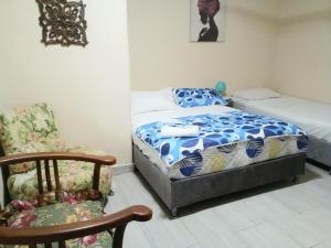 Postel nebo postele na pokoji v ubytování Sai hostels