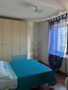 Ένα ή περισσότερα κρεβάτια σε δωμάτιο στο Appartamento Piazza di Montese 1