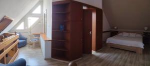 Postel nebo postele na pokoji v ubytování Abbázia Club Hotel Kék