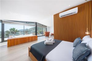 เตียงในห้องที่ Eco Villa Nova +23 ภาพ