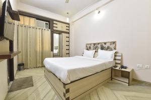 Ένα ή περισσότερα κρεβάτια σε δωμάτιο στο Hotel The Grand Kailash +55 φωτογραφίες