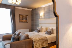 Ένα ή περισσότερα κρεβάτια σε δωμάτιο στο The Royal Hotel +55 φωτογραφίες