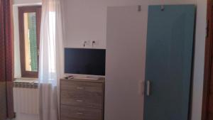 TV a/nebo společenská místnost v ubytování Penthouse apartment