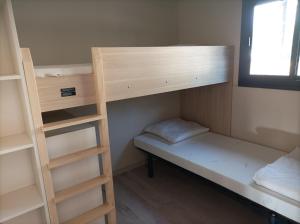 Ένα ή περισσότερα κρεβάτια σε δωμάτιο στο Camping Hello Soleil