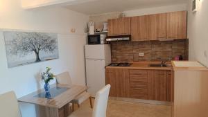 Kuchyň nebo kuchyňský kout v ubytování Apartment Igralište Mirakul
