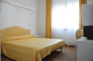 Postel nebo postele na pokoji v ubytování Hotel Sirena