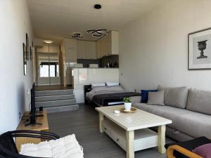 a living room with a couch and a table at Dream View in Krašići