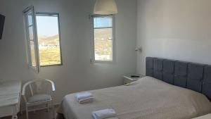 Postel nebo postele na pokoji v ubytování ENE’S Mýkonos