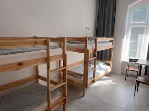 Postel nebo postele na pokoji v ubytování Golden Hostel