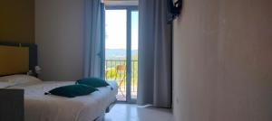 Postel nebo postele na pokoji v ubytování Tuscasì Aparthotel