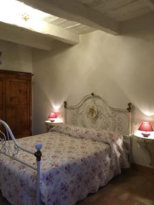 En eller flere senge i et værelse på Appartamenti del Ceccottino
