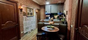 a small kitchen with a table in a room at Cascade Heritage Inn in Yerevan