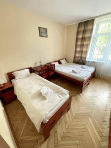 Posteľ alebo postele v izbe v ubytovaní Parkowa Rezydencja Hubal