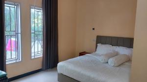 Postel nebo postele na pokoji v ubytování LaPrasmi Hotel