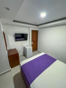 Postel nebo postele na pokoji v ubytování Cataleya Hotel