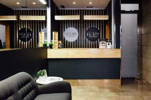 a coffee shop with a couch in a lobby at Valenciaflats Ciudad de las Ciencias in Valencia +61 photos