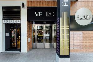 a storefront of a store with the doors open at Valenciaflats Ciudad de las Ciencias in Valencia