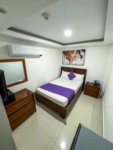 Postel nebo postele na pokoji v ubytování Cataleya Hotel