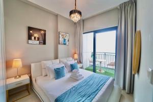 Postel nebo postele na pokoji v ubytování 1BR Zada Tower in Business Bay2 Dubai BSHH