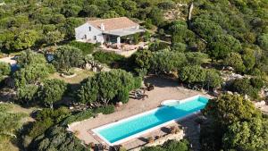 an aerial view of a house with a swimming pool at Stazzu La Sarra in Cannigione +32 photos