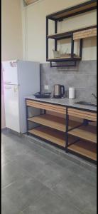 a kitchen with a white refrigerator and a counter top at Umbrella4 in La Rioja