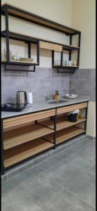 a kitchen with a sink and a counter top at Umbrella4 in La Rioja +17 photos