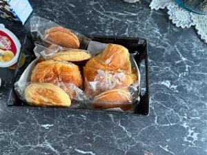 a bunch of croissants in plastic bags on a counter at Villa in Ingersheim