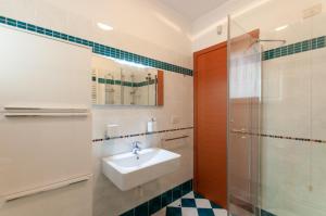 a bathroom with a sink and a shower at AnnaLand in Padenghe sul Garda +26 photos