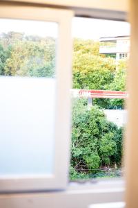 Taman di luar Appartement sous toit lumineux avec garage et 4 pièces en enfilade
