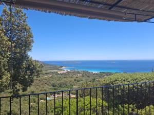 a view of the ocean from a balcony at Résidence Belvedere de Palombaggia in Porto-Vecchio