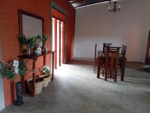 a room with a table and chairs and a dining room at Mahiyanganaya Holiday Resort in Mahiyangana +22 photos